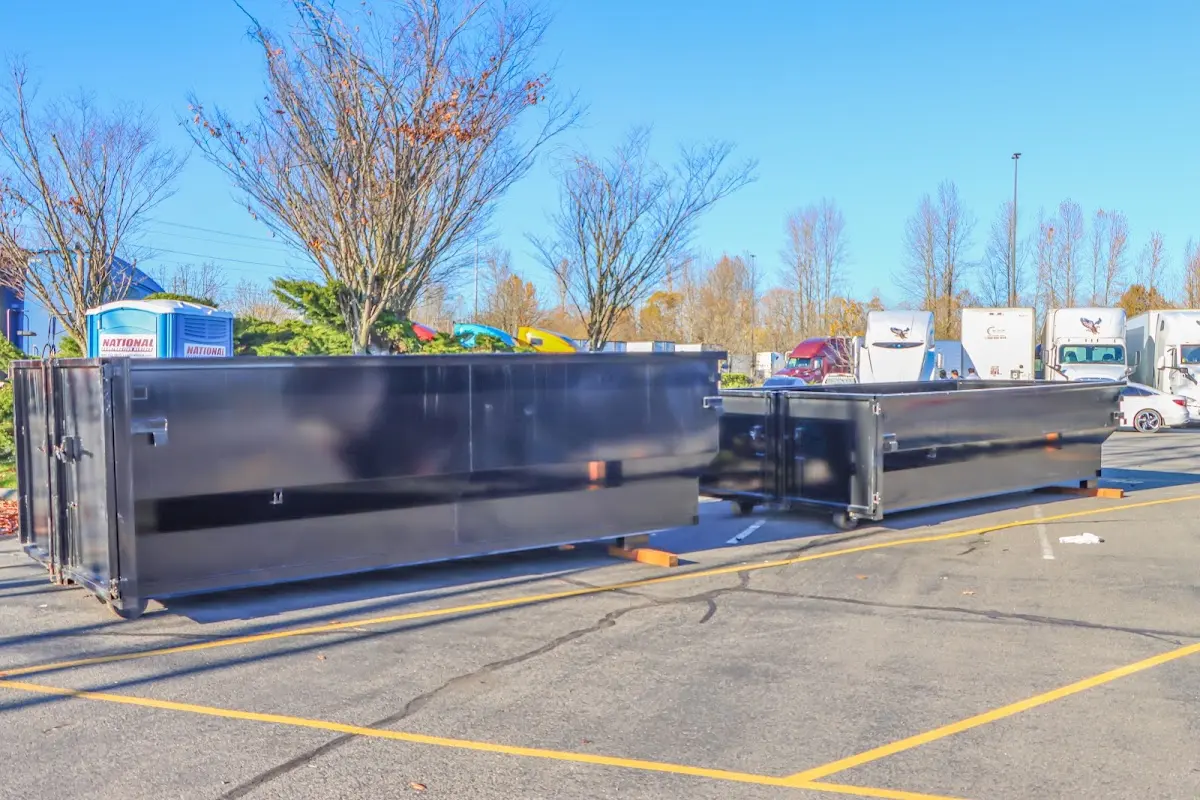 Professional dumpster rental service with roll-off container on residential driveway in Pickerington